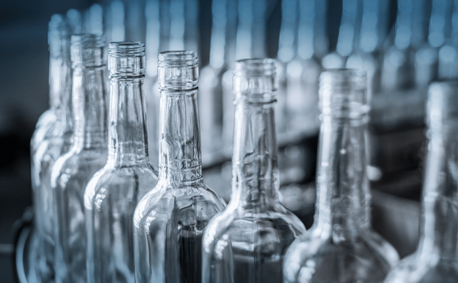 Spin-shock-tilt-pressure-on-the-bottling-line Image of glass wine bottles showing spin, shock, tilt and pressure on the botteling line