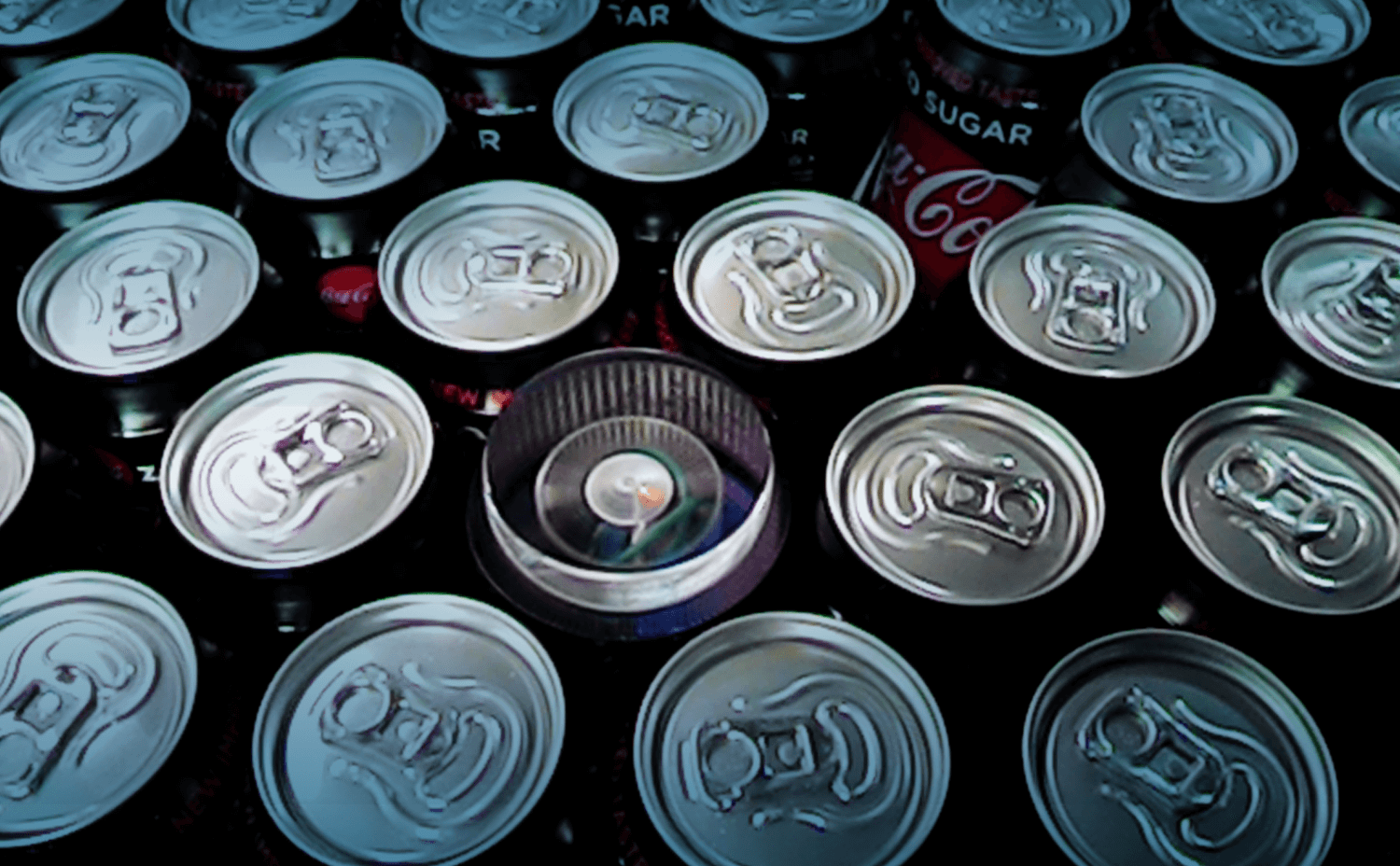 sensor show in processing line with cans sensor showing amoung cans in a processing line