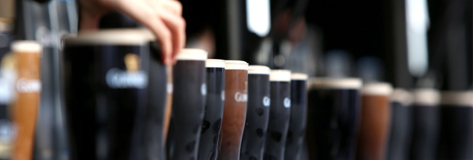 closeup blurred image of alcohol in glasses
